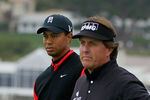 PEBBLE BEACH, CA - FEBRUARY 12: (L-R) Tiger Woods and Phil Mickelson wait on the seventh hole tee during the final round of the AT&T Pebble Beach National Pro-Am at Pebble Beach Golf Links on February 12, 2012 in Pebble Beach, California.  (Photo by Jeff Gross/Getty Images)