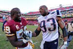 LANDOVER, MD - DECEMBER 11: London Fletcher #59 of the Washington Redskins greets Andre Carter #93 of the New England Patriots after the game at FedEx Field on December 11, 2011 in Landover, Maryland. (Photo by Scott Cunningham/Getty Images)