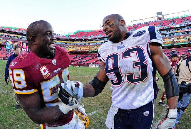LANDOVER, MD - DECEMBER 11: London Fletcher #59 of the Washington Redskins greets Andre Carter #93 of the New England Patriots after the game at FedEx Field on December 11, 2011 in Landover, Maryland. (Photo by Scott Cunningham/Getty Images)
