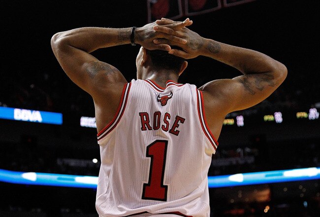 MIAMI, FL - JANUARY 29:  Derrick Rose #1 of the Chicago Bulls looks on during a game against the Miami Heat at American Airlines Arena on January 29, 2012 in Miami, Florida. NOTE TO USER: User expressly acknowledges and agrees that, by downloading and/or using this Photograph, User is consenting to the terms and conditions of the Getty Images License Agreement.  (Photo by Mike Ehrmann/Getty Images)