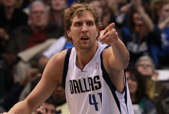 DALLAS, TX - JANUARY 04:  Dirk Nowitzki #41 of the Dallas Mavericks reacts after scoring against the Phoenix Suns at American Airlines Center on January 4, 2012 in Dallas, Texas. Nowitzki was playing in his 1,000 career game.  NOTE TO USER: User expressly acknowledges and agrees that, by downloading and/or using this Photograph, user is consenting to the terms and conditions of the Getty Images License Agreement.  (Photo by Ronald Martinez/Getty Images)