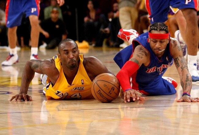 LOS ANGELES, CA - NOVEMBER 14: Kobe Bryant #24 of the Los Angeles Lakers and Allen Iverson #1 of the Detroit Pistons dive for a loose ball on November 14, 2008 at Staples Center in Los Angeles, California. The Pistons won 106-95.   NOTE TO USER: User expressly acknowledges and agrees that, by downloading and/or using this Photograph, user is consenting to the terms and conditions of the Getty Images License Agreement.  (Photo by Stephen Dunn/Getty Images)