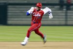 SAN DIEGO - MARCH 18: Yoennis Cespedes #51 of Cuba runs to third base after hitting into the corner of the outfield againts Japan during the 2009 World Baseball Classic Round 2 Pool 1 Game 5 on March 18, 2009 at Petco Park in San Diego, California.  (Photo by Jeff Bottari/Getty Images)