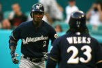 MIAMI GARDENS, FL - JUNE 04:  Nyjer Morgan #2 of the Milwaukee Brewers celebrates a home run with teammate Rickie Weeks against the Florida Marlins at Sun Life Stadium on June 4, 2011 in Miami Gardens, Florida.  (Photo by Marc Serota/Getty Images)