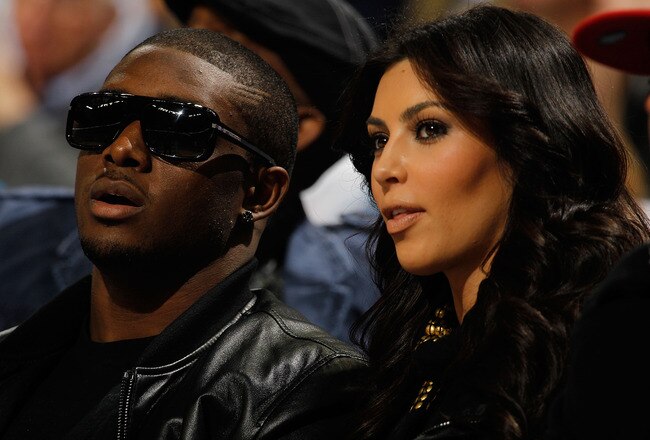NEW ORLEANS - JANUARY 18:  New Orleans Saints player Reggie Bush sits with Kim Kardashian on the court during the game between the San Antonio Spurs and the New Orleans Hornets at New Orleans Arena on January 18, 2010 in New Orleans, Louisiana.   NOTE TO USER: User expressly acknowledges and agrees that, by downloading and/or using this Photograph, User is consenting to the terms and conditions of the Getty Images License Agreement.  (Photo by Chris Graythen/Getty Images)