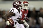 ARLINGTON, TX - OCTOBER 01:  Christine Michael #33 of the Texas A&M Aggies runs for a touchdown against the Arkansas Razorbacks at Cowboys Stadium on October 1, 2011 in Arlington, Texas.  (Photo by Ronald Martinez/Getty Images)