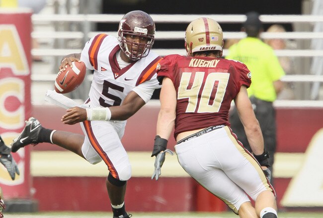 CHESTNUT HILL, MA - SEPTEMBER 25:  Tyrod Taylor #5 of the Virginia Tech Hokies scrambles with the ball as Luke Kuechly #40 of the Boston College Eagles defends on September 25, 2010 at Alumni Stadium in Chestnut Hill, Massachusetts.  (Photo by Elsa/Getty Images)