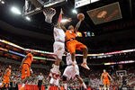 LOUISVILLE, KY - FEBRUARY 12:  George Goode #0 of the Louisville Cardinals defends the shot of C.J. Fair #5 of the Syracuse Orange during the Big East Conference game against  at the KFC Yum! Center on February 12, 2011 in Louisville, Kentucky.  (Photo by Andy Lyons/Getty Images)