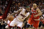 MIAMI, FL - APRIL 06:  Lebron James #6 of the Miami Heat is guarded by by Corey Maggette #5 of the Milwaukee Bucks during a game at American Airlines Arena on April 6, 2011 in Miami, Florida. NOTE TO USER: User expressly acknowledges and agrees that, by downloading and/or using this Photograph, User is consenting to the terms and conditions of the Getty Images License Agreement.  (Photo by Mike Ehrmann/Getty Images)