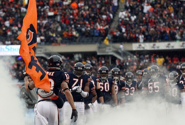 CHICAGO, IL - JANUARY 16:  Johnny Knox #13 of the Chicago Bears runs out of the tunnel with a flag during player introductions to take on the Seattle Seahawks in the 2011 NFC divisional playoff game at Soldier Field on January 16, 2011 in Chicago, Illinois.  (Photo by Doug Pensinger/Getty Images)