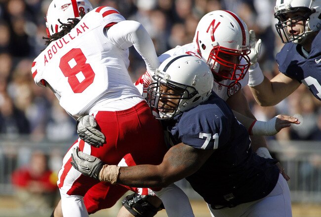 STATE COLLEGE, PA - NOVEMBER 12:  Devon Still #71 of the Penn State Nittany Lions tackles Ameer Abdullah #8 of the Nebraska Cornhuskers during the game on November 12, 2011 at Beaver Stadium in State College, Pennsylvania.  (Photo by Justin K. Aller/Getty Images)