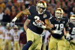 ORLANDO, FL - DECEMBER 29: Wide receiver Michael Floyd #3 of the Notre Dame Fight Irish runs upfield against the Florida State Seminoles in the Champs Sports Bowl December 29, 2011 at the Florida Citrus Bowl in Orlando, Florida.  FSU won 18 - 14. (Photo by Al Messerschmidt/Getty Images)