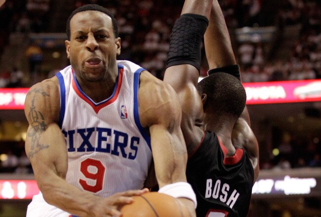 PHILADELPHIA, PA - APRIL 21: Andre Iguodala #9 of the Philadelphia 76ers drives to the basket against Chris Bosh #1 of the Miami Heat during the second half of game three of the Eastern Conference Quarterfinals at Wells Fargo Center on April 21, 2011 in Philadelphia, Pennsylvania.NOTE TO USER: User expressly acknowledges and agrees that, by downloading and/or using this Photograph, User is consenting to the terms and conditions of the Getty Images License Agreement.  (Photo by Rob Carr/Getty Images)