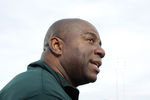 SAN DIEGO, CA - NOVEMBER 11:  Basketball hall-of-famer and Michigan State Spartans alum Earvin 'Magic' Johnson talks with members of the media before the North Carolina Tar Heels take on the Spartans in the NCAA men's college basketball Carrier Classic aboard the flight deck of the USS Carl Vinson on November 11, 2011 in San Diego, California.  (Photo by Harry How/Getty Images)