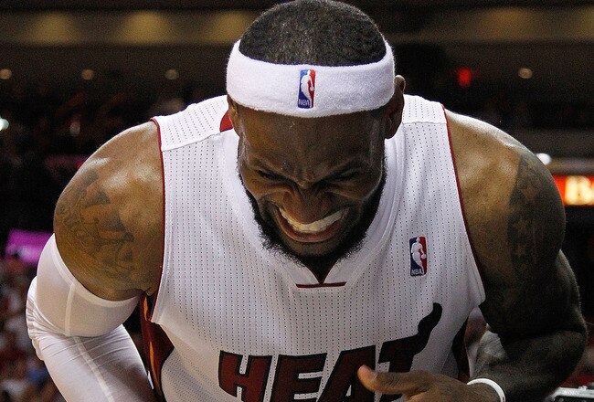 MIAMI, FL - JANUARY 27:  LeBron James #6 of the Miami Heat reacts to jamming his finger during a game against the New York Knicks at American Airlines Arena on January 27, 2012 in Miami, Florida. NOTE TO USER: User expressly acknowledges and agrees that, by downloading and/or using this Photograph, User is consenting to the terms and conditions of the Getty Images License Agreement.  (Photo by Mike Ehrmann/Getty Images)