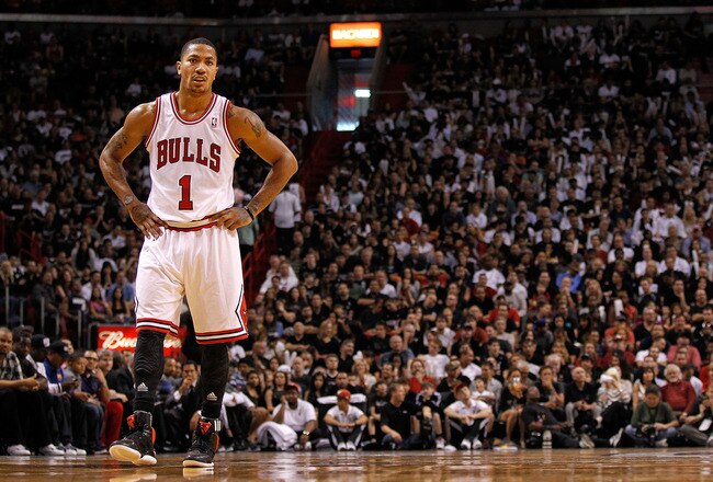 MIAMI, FL - JANUARY 29:  Derrick Rose #1 of the Chicago Bulls looks on during a game against the Miami Heat at American Airlines Arena on January 29, 2012 in Miami, Florida. NOTE TO USER: User expressly acknowledges and agrees that, by downloading and/or using this Photograph, User is consenting to the terms and conditions of the Getty Images License Agreement.  (Photo by Mike Ehrmann/Getty Images)