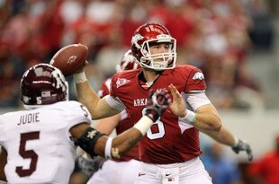 ARLINGTON, TX - OCTOBER 01:  Quarterback Tyler Wilson #8 of the Arkansas Razorbacks throws against the Texas A&M Aggies at Cowboys Stadium on October 1, 2011 in Arlington, Texas.  (Photo by Ronald Martinez/Getty Images)