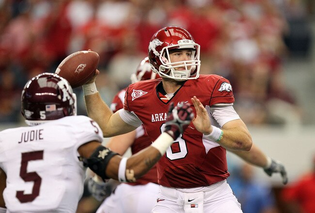 ARLINGTON, TX - OCTOBER 01:  Quarterback Tyler Wilson #8 of the Arkansas Razorbacks throws against the Texas A&M Aggies at Cowboys Stadium on October 1, 2011 in Arlington, Texas.  (Photo by Ronald Martinez/Getty Images)