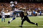NEW ORLEANS, LA - JANUARY 07:   Calvin Johnson #81 of the Detroit Lions makesa touchdown catch against  Patrick Robinson #21 of the New Orleans Saints during their 2012 NFC Wild Card Playoff game at Mercedes-Benz Superdome on January 7, 2012 in New Orleans, Louisiana.  (Photo by Chris Graythen/Getty Images)