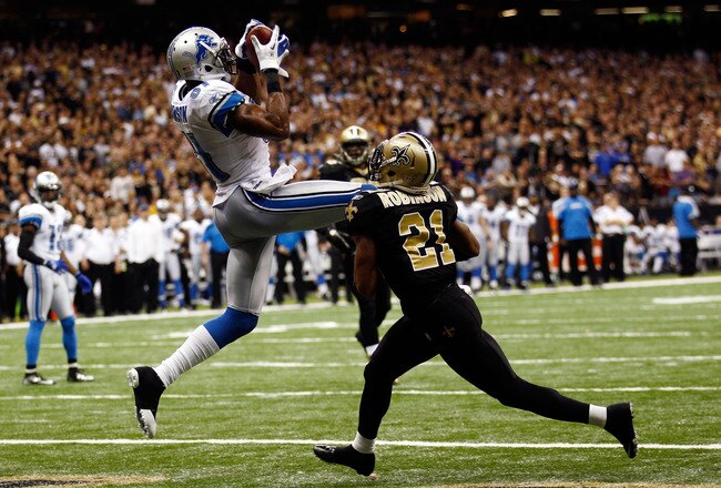 NEW ORLEANS, LA - JANUARY 07:   Calvin Johnson #81 of the Detroit Lions makesa touchdown catch against  Patrick Robinson #21 of the New Orleans Saints during their 2012 NFC Wild Card Playoff game at Mercedes-Benz Superdome on January 7, 2012 in New Orleans, Louisiana.  (Photo by Chris Graythen/Getty Images)