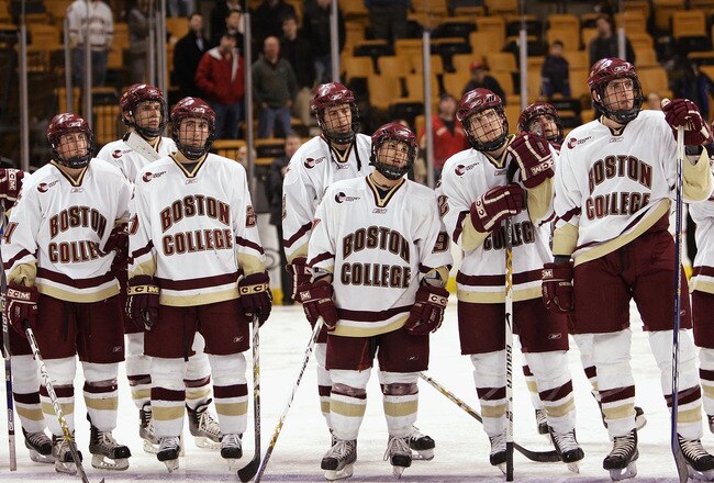 BOSTON - FEBRUARY 12:  Members of the Boston College Eagles watch as the Beanpot trophy is handed to the Boston University Terriers after the Beanpot Tournament Championship Game on February 12, 2007 at TD Banknorth Garden in Boston, Massachusetts. Boston University defeated Boston College 2-1 in overtime. (Photo by Elsa/Getty Images)