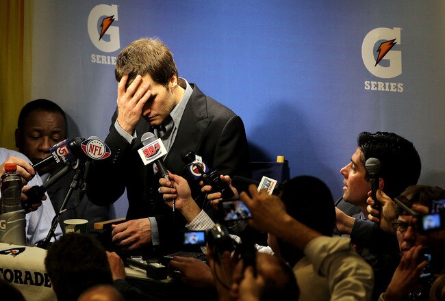 INDIANAPOLIS, IN - FEBRUARY 05:  Quarterback Tom Brady #12 of the New England Patriots speaks to the media after losing to the New York Giants in Super Bowl XLVI at Lucas Oil Stadium on February 5, 2012 in Indianapolis, Indiana. The New York Giants defeated the New England Patriots 21-17.  (Photo by Jamie Squire/Getty Images)