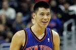 WASHINGTON, DC - FEBRUARY 08:  Jeremy Lin #17 of the New York Knicks smiles after scoring against the Washington Wizards during the second half at Verizon Center on February 8, 2012 in Washington, DC.   NOTE TO USER: User expressly acknowledges and agrees that, by downloading and or using this photograph, User is consenting to the terms and conditions of the Getty Images License Agreement.  (Photo by Rob Carr/Getty Images)