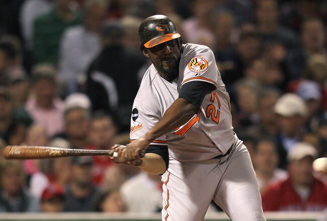 BOSTON, MA - SEPTEMBER 20:   Vladimir Guerrero #27 of the Baltimore Orioles slaps the ball to right field where Josh Reddick #16 of the Boston Red Sox (not pictured) mishandled a fly ball in the third inning at Fenway Park September 20, 2011 in Boston, Massachusetts. (Photo by Jim Rogash/Getty Images)