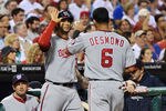 PHILADELPHIA, PA - SEPTEMBER 22: Michael Morse #38 of the Washington Nationals congratulates teammate Ian Desmond #6  after scoring the second run of the game against the Philadelphia Phillies at Citizens Bank Park on September 22, 2011 in Philadelphia, Pennsylvania. (Photo by Drew Hallowell/Getty Images)