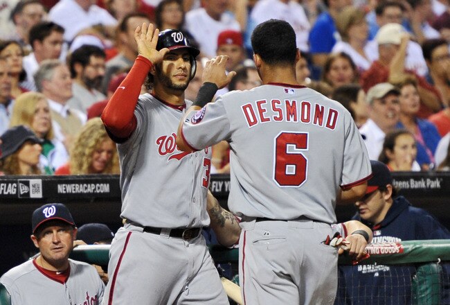 PHILADELPHIA, PA - SEPTEMBER 22: Michael Morse #38 of the Washington Nationals congratulates teammate Ian Desmond #6  after scoring the second run of the game against the Philadelphia Phillies at Citizens Bank Park on September 22, 2011 in Philadelphia, Pennsylvania. (Photo by Drew Hallowell/Getty Images)