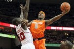LOUISVILLE, KY - FEBRUARY 13:  C.J. Fair #5 of the Syracuse Orange shoots the ball while defended by Gorgui Dieng #10 of the Louisville Cardinals during the Big East Conference game at KFC YUM! Center on February 13, 2012 in Louisville, Kentucky.  (Photo by Andy Lyons/Getty Images)
