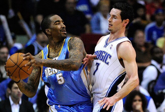 ORLANDO, FL - MARCH 28:  J.J Redick #7 of the Orlando Magic plays defense against J.R. Smith #5 of the Denver Nuggets during the game at Amway Arena on March 28, 2010 in Orlando, Florida.  NOTE TO USER: User expressly acknowledges and agrees that, by downloading and/or using this Photograph, user is consenting to the terms and conditions of the Getty Images License Agreement.  (Photo by Sam Greenwood/Getty Images)