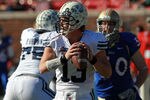 DALLAS, TX - DECEMBER 30:  Riley Nelson #13 of the Brigham Young Cougars throws against the Brigham Young Cougars during the Bell Helicopter Armed Forces Bowl at Gerald J. Ford Stadium on December 30, 2011 in Dallas, Texas.  (Photo by Ronald Martinez/Getty Images)