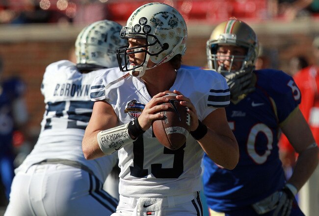 DALLAS, TX - DECEMBER 30:  Riley Nelson #13 of the Brigham Young Cougars throws against the Brigham Young Cougars during the Bell Helicopter Armed Forces Bowl at Gerald J. Ford Stadium on December 30, 2011 in Dallas, Texas.  (Photo by Ronald Martinez/Getty Images)