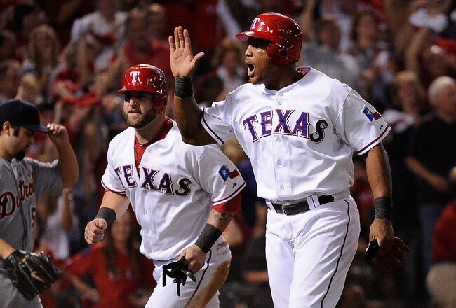 ARLINGTON, TX - OCTOBER 15:  Adrian Beltre #29 and Mike Napoli #25 the Texas Rangers celebrate after scoring on a single by David Murphy #7 in the third inning of Game Six of the American League Championship Series against the Detroit Tigers at Rangers Ballpark in Arlington on October 15, 2011 in Arlington, Texas.  (Photo by Kevork Djansezian/Getty Images)