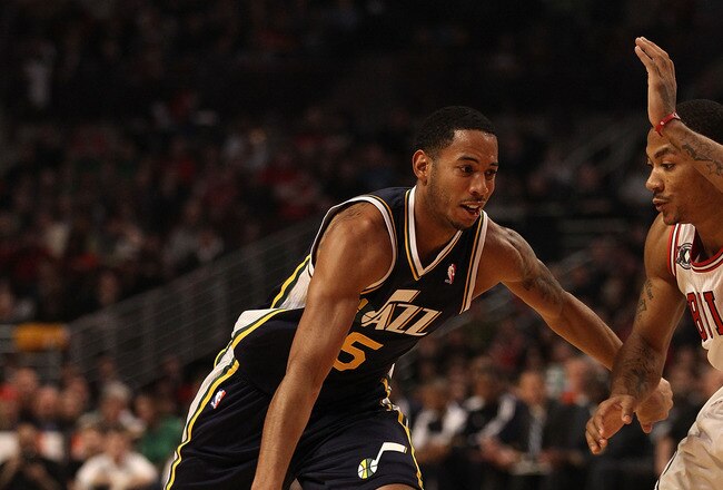 CHICAGO, IL - MARCH 12: Devin Harris #5 of the Utah Jazz drives against Derrick Rose #1 of the Chicago Bulls at the United Center on March 12, 2011 in Chicago, Illinois. The Bulls defeated the Jazz 118-100. NOTE TO USER: User expressly acknowledges and agrees that, by downloading and/or using this photograph, User is consenting to the terms and conditions of the Getty Images License Agreement. (Photo by Jonathan Daniel/Getty Images)