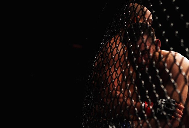 SYDNEY, AUSTRALIA - FEBRUARY 27:  BJ Penn of the USA is pinned to the cage by Jon Fitch of the USA during their welterweight bout part of UFC 127 at Acer Arena on February 27, 2011 in Sydney, Australia.  (Photo by Mark Kolbe/Getty Images)