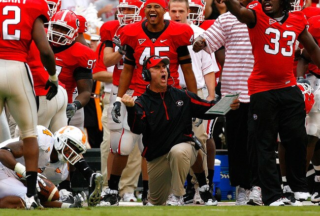 ATHENS, GA - OCTOBER 11:  Defensive coordinator Willie Martinez (C) of the Georgia Bulldogs and the bench errupt in celebration after a defensive stop against the Tennessee Volunteers during the game at Sanford Stadium on October 11, 2008 in Athens, Georgia.  (Photo by Kevin C. Cox/Getty Images)