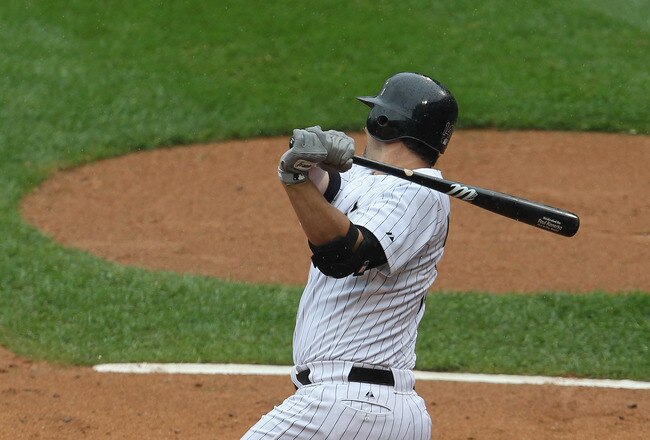 CHICAGO, IL - SEPTEMBER 14: Paul Konerko #14 of the Chicago White Sox hits a single to pick up his 99th and 100th RBI for the season against the Detroit Tigers at U.S. Cellular Field on September 14, 2011 in Chicago, Illinois. (Photo by Jonathan Daniel/Getty Images)