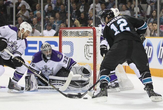 SAN JOSE, CA - APRIL 23:  Rob Scuderi #7 and Jonathan Quick #32 of the Los Angeles Kings stop Patrick Marleau #12 of the San Jose Sharks from scoring in game five of the Western Conference Quarterfinals during the 2011 NHL Stanley Cup Playoffs at HP Pavilion on April 23, 2011 in San Jose, California.  (Photo by Ezra Shaw/Getty Images)
