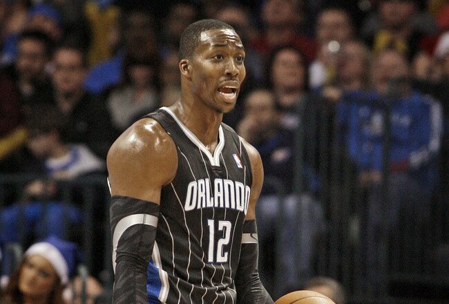OKLAHOMA CITY, OK - DECEMBER 25:  Dwight Howard #12 of the Orlando Magic questions a call during the NBA season opening game against the Oklahoma City Thunder December 25, 2011 at the Chesapeake Energy Arena in Oklahoma City, Oklahoma.  Oklahoma City defeated Orlando 97-89. NOTE TO USER: User expressly acknowledges and agrees that, by downloading and or using this Photograph, user is consenting to the terms and conditions of the Getty Images License Agreement.  (Photo by Brett Deering/Getty Images)