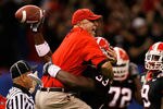 NEW ORLEANS - JANUARY 01:  Defensive coordinator Willie Martinez and Dannell Ellerbe #33 of the Georgia Bulldogs celebrate after Ellerbe intercepted the ball against the Hawai'i Warriors during the Allstate Sugar Bowl at the Louisiana Superdome on January 1, 2008 in New Orleans, Louisiana. Georgia won 41-10. (Photo by Kevin C. Cox/Getty Images)
