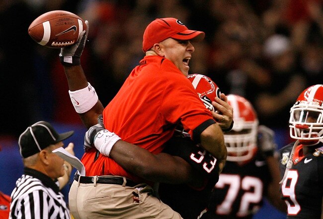 NEW ORLEANS - JANUARY 01:  Defensive coordinator Willie Martinez and Dannell Ellerbe #33 of the Georgia Bulldogs celebrate after Ellerbe intercepted the ball against the Hawai'i Warriors during the Allstate Sugar Bowl at the Louisiana Superdome on January 1, 2008 in New Orleans, Louisiana. Georgia won 41-10. (Photo by Kevin C. Cox/Getty Images)