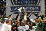 EUGENE, OR - DECEMBER 02 : Members of the Oregon Ducks celebrate winning the Pac-12 Championship against the UCLA Bruins at Autzen Stadium on December 2, 2011 in Eugene, Oregon. The Ducks won the game 49-31 to earn a berth in the Rose Bowl. (Photo by Steve Dykes/Getty Images)