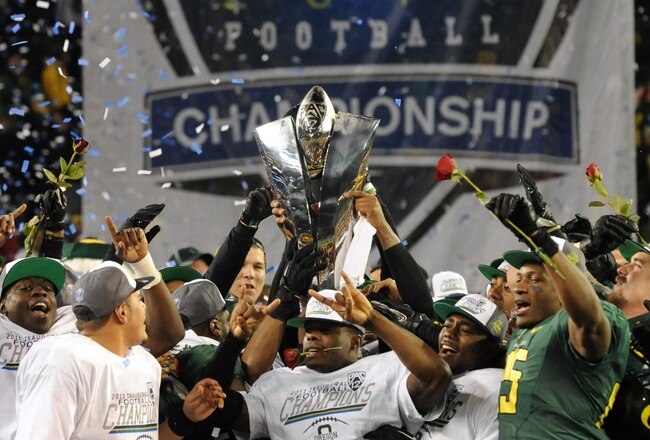 EUGENE, OR - DECEMBER 02 : Members of the Oregon Ducks celebrate winning the Pac-12 Championship against the UCLA Bruins at Autzen Stadium on December 2, 2011 in Eugene, Oregon. The Ducks won the game 49-31 to earn a berth in the Rose Bowl. (Photo by Steve Dykes/Getty Images)