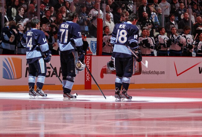 PITTSBURGH, PA - FEBRUARY 11:  Chris Kunitz #14, Evgeni Malkin #71 and James Neal #18 of the Pittsburgh Penguins stand during the National Anthem before the game against the Winnipeg Jets  at Consol Energy Center on February 11, 2012 in Pittsburgh, Pennsylvania.  (Photo by Justin K. Aller/Getty Images)