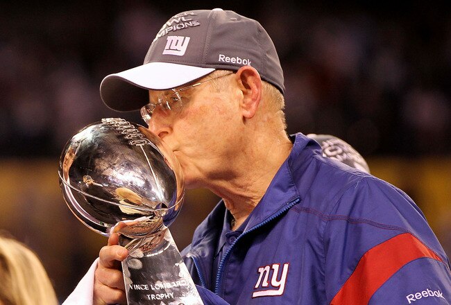INDIANAPOLIS, IN - FEBRUARY 05:  Head coach Tom Coughlin of the New York Giants kisses the Vince Lombardi Trophy after defeating the New England Patriots in Super Bowl XLVI at Lucas Oil Stadium on February 5, 2012 in Indianapolis, Indiana. The New York Giants defeated the New England Patriots 21-17.  (Photo by Jamie Squire/Getty Images)