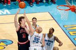 NEW ORLEANS, LA - FEBRUARY 08:  Omer Asik #3 of the Chicago Bulls shoots the ball over Chris Kaman #35 of the New Orleans Hornets at New Orleans Arena on February 8, 2012 in New Orleans, Louisiana.  NOTE TO USER: User expressly acknowledges and agrees that, by downloading and or using this photograph, User is consenting to the terms and conditions of the Getty Images License Agreement.  (Photo by Chris Graythen/Getty Images)