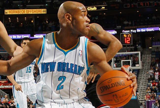 NEW ORLEANS, LA - FEBRUARY 08:  Jarrett Jack #2 of the New Orleans Hornets drives the ball around Joakim Noah #13 of the Chicago Bulls at New Orleans Arena on February 8, 2012 in New Orleans, Louisiana.  NOTE TO USER: User expressly acknowledges and agrees that, by downloading and or using this photograph, User is consenting to the terms and conditions of the Getty Images License Agreement.  (Photo by Chris Graythen/Getty Images)