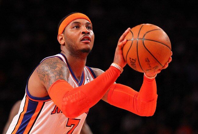 NEW YORK, NY - DECEMBER 21:  Carmelo Anthony #7 of the New York Knicks shoots a foul shot against the New Jersey Nets during their pre season game  at Madison Square Garden on December 21, 2011 in New York City.  (Photo by Al Bello/Getty Images) NOTE TO USER: User expressly acknowledges and agrees that, by downloading and or using this photograph, User is consenting to the terms and conditions of the Getty Images License Agreement.